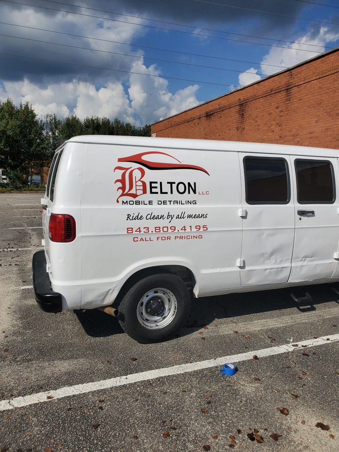 White 'BELTON Mobile Detailing' service van with red car-graphic side branding