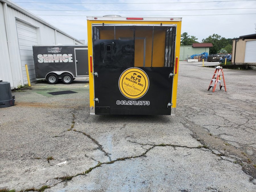 Side view of the 'MJ'S ROLLING BBQ Seafood Express' concession trailer wrap
