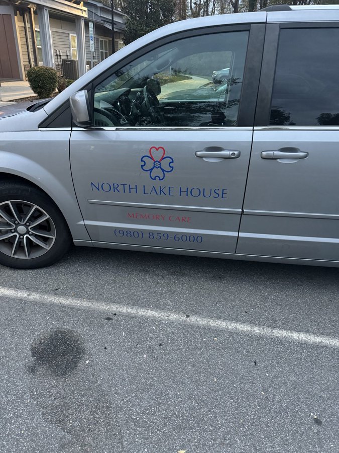Silver 'NORTH LAKE HOUSE' fleet van with restrained corporate side graphics