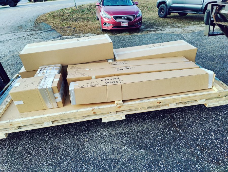 Long-format boxes palletized and labeled for shipment to Goose Creek SC