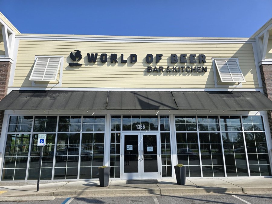 'World of Beer Bar & Kitchen' dimensional channel letters mounted on a cream-and-brown storefront