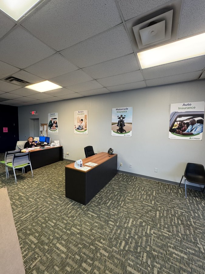 Open office interior with brand posters and welcome graphics