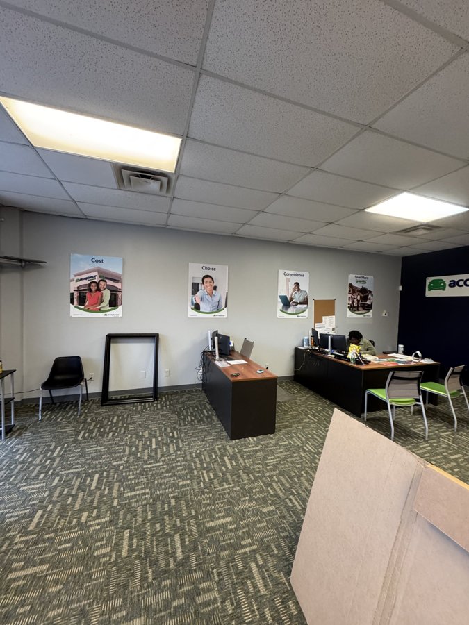 Full-view of Acceptance Insurance interior workspace with brand graphics