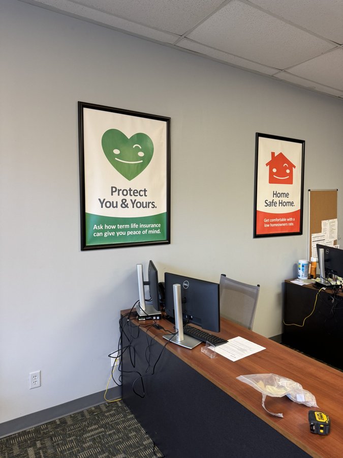 Interior office space with framed brand graphics on the wall