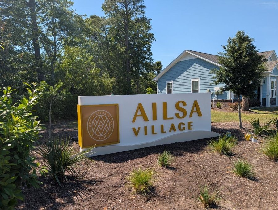 Ailsa Village community entrance monument with dimensional letters against landscaped bed