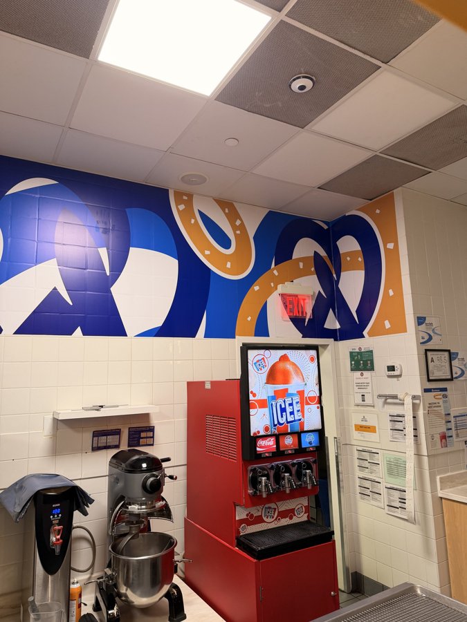 Full interior view of Auntie Anne's with completed wall graphics and equipment