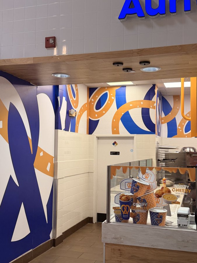 Auntie Anne's storefront with interior wraps and lighting
