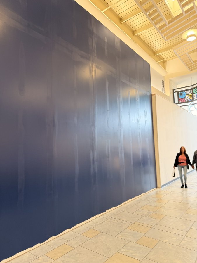 Bath & Body Works hoarding stretching down a mall corridor