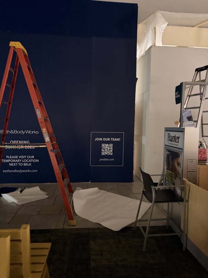 Bath & Body Works hoarding install day with tools and ladder
