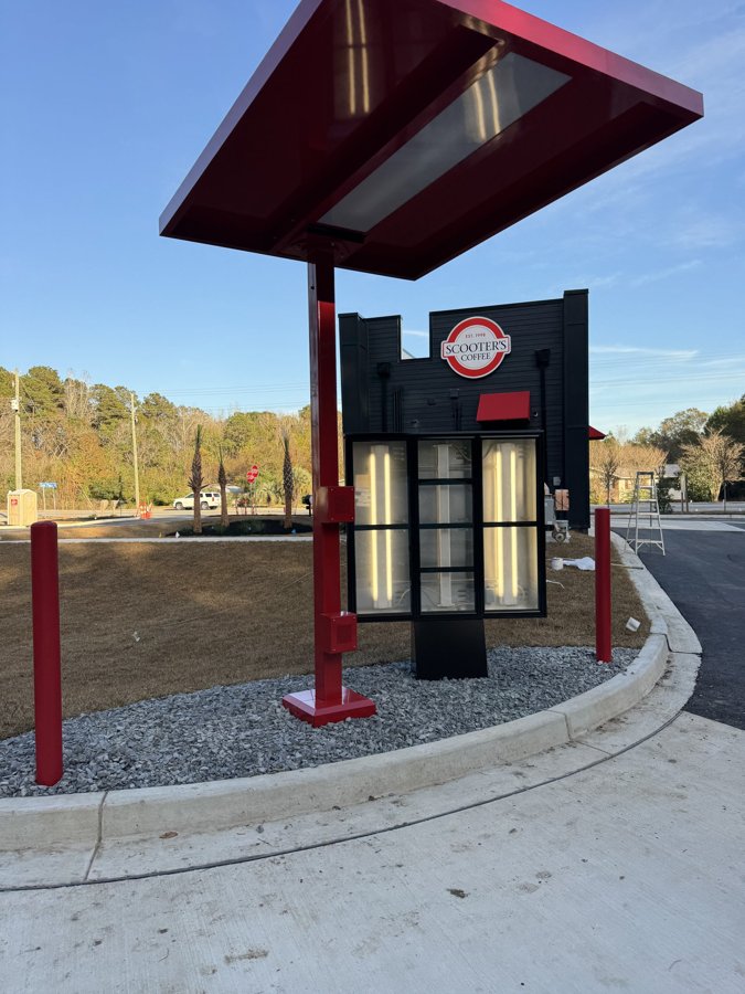 Custom illuminated fuel station canopy column with red trim