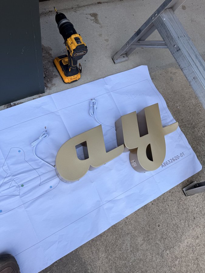 Gold letters Y and 4 fresh from fabrication with drill in view