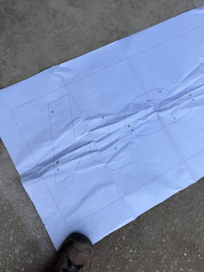 White template with gold letter layout on the ground pre-install