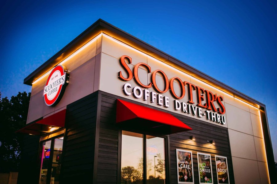 Wide illuminated night view of Scooter's Coffee Drive-Thru
