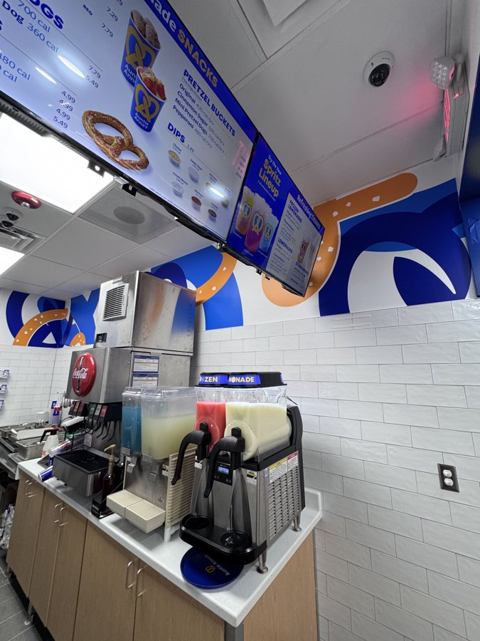 Interior of a slushie/beverage bar with custom blue ceiling elements