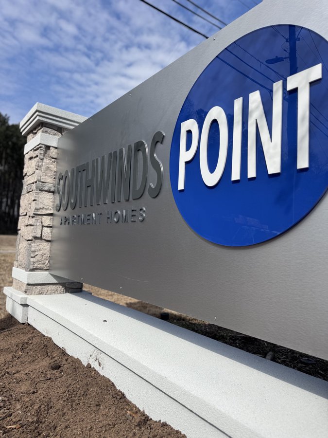Angled hero shot of Southwinds Point stone monument entrance sign