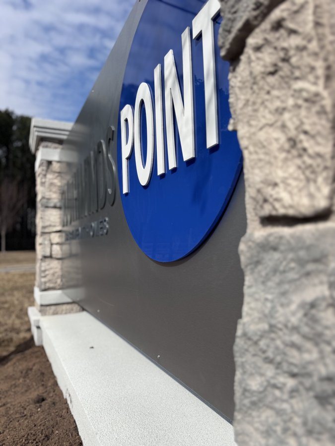 Angled detail of Southwinds Point monument stonework and lettering