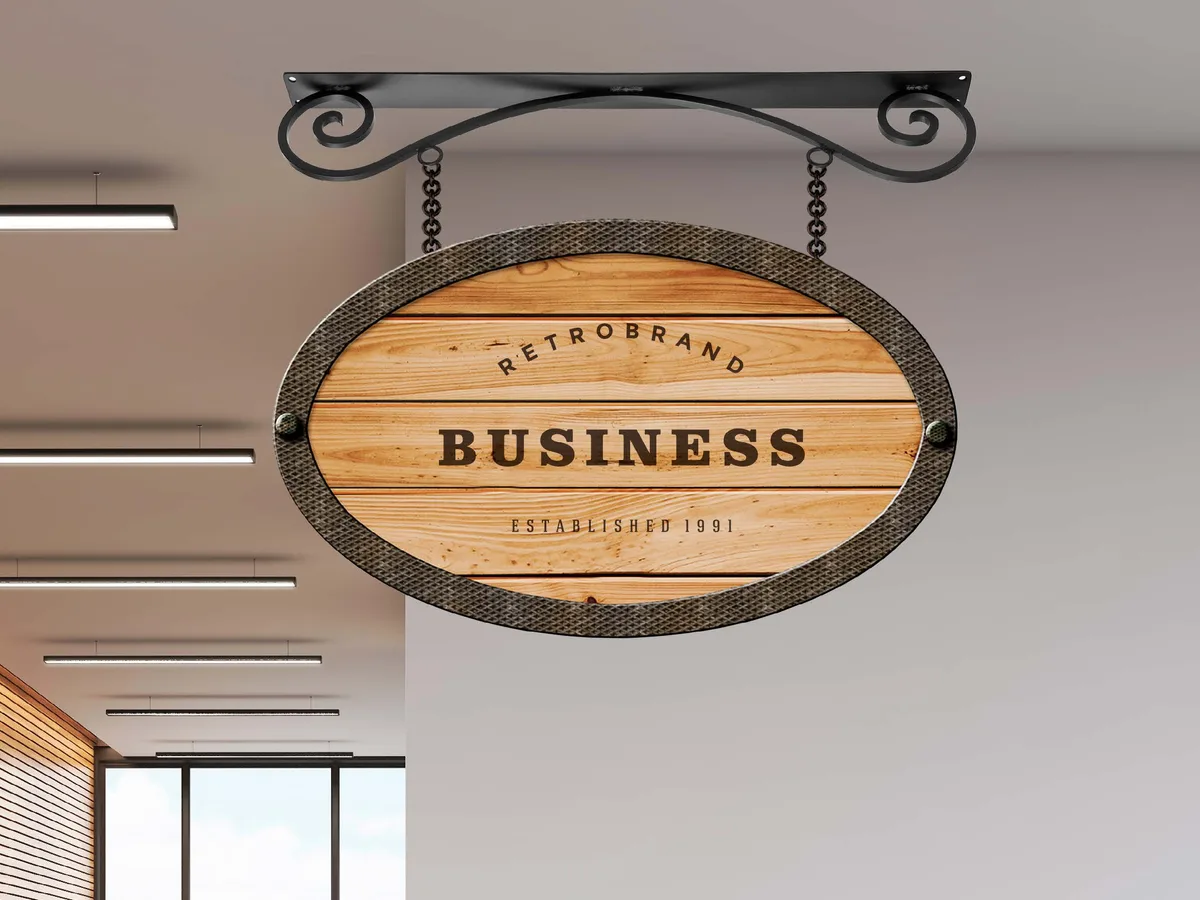 BeaconCarved hanging sign installed on a black exterior bracket
